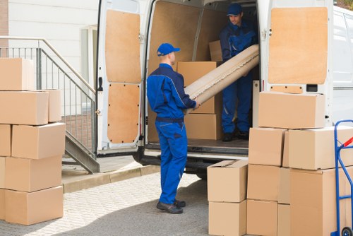 Man with van loading items in Camberwell street