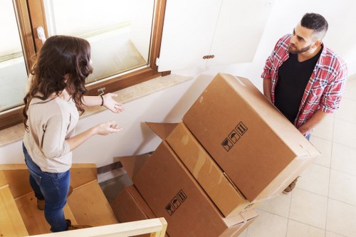 Commercial movers handling desks and equipment in south London