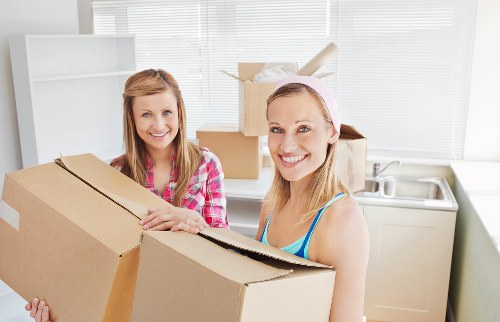 Boxes and household items being organised for transport