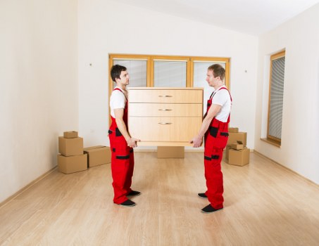 Loading reusable household items for charity donation during a move in Camberwell